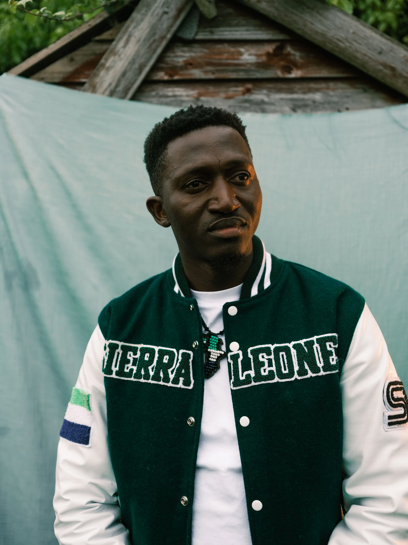Portrait of Abdulai standing by a window