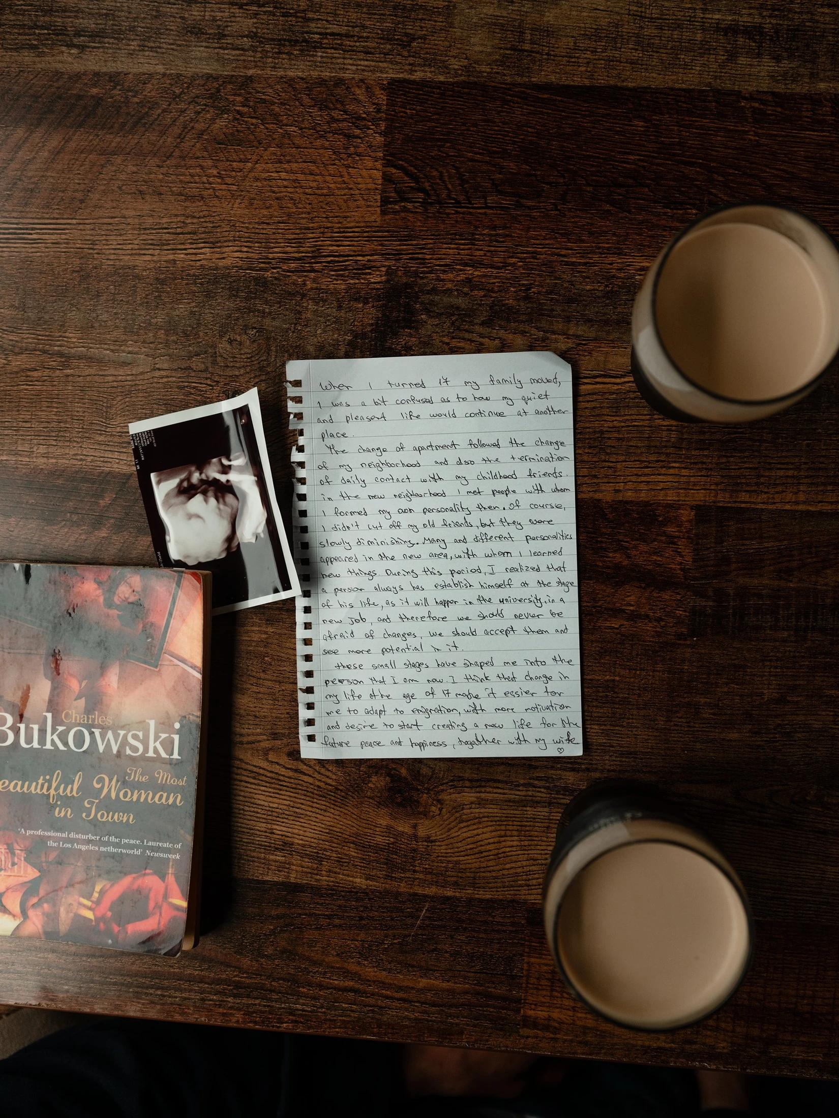 Gega’s handwritten letter on a table with books and cups