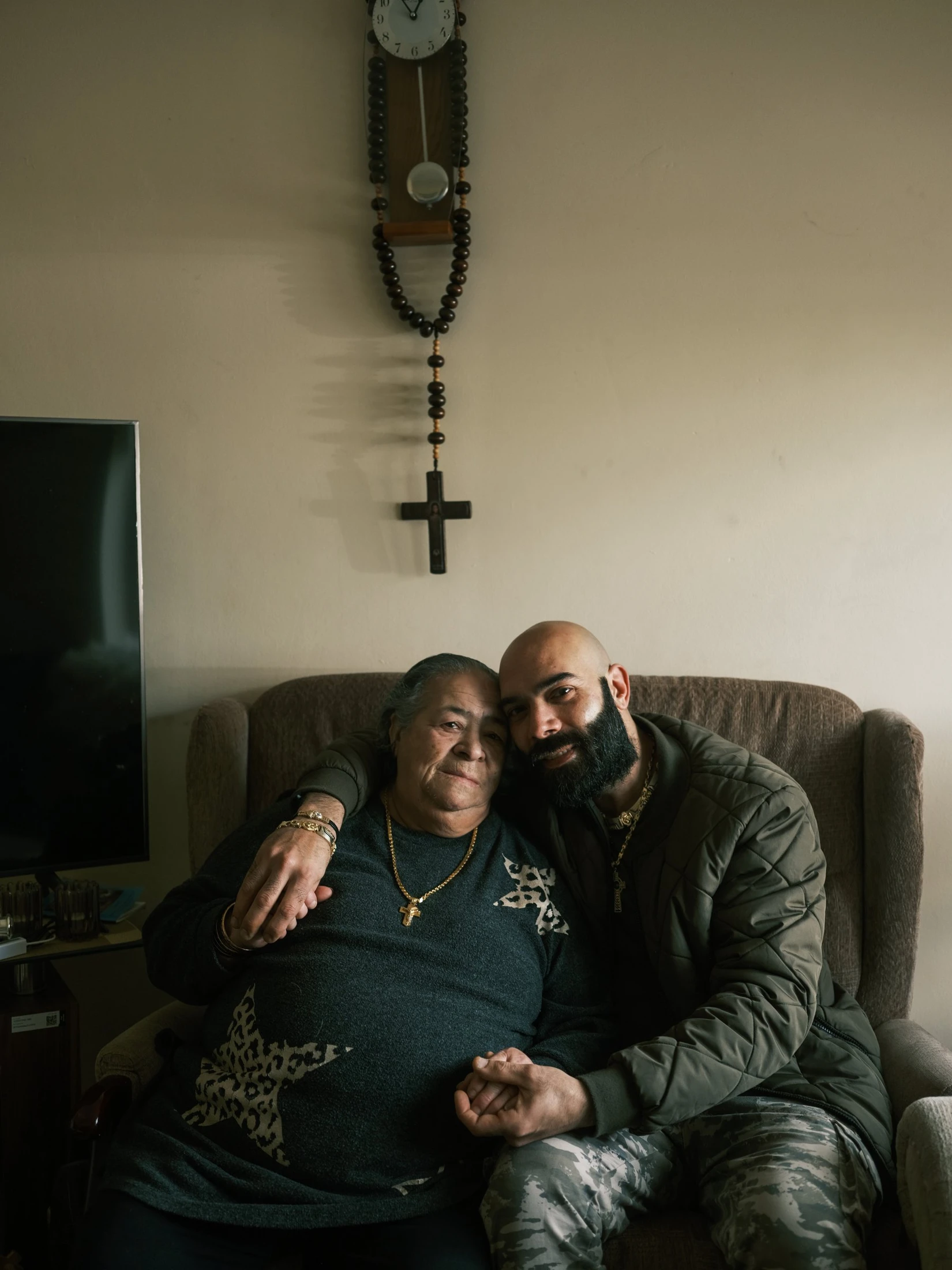Salim and his mother together on a sofa