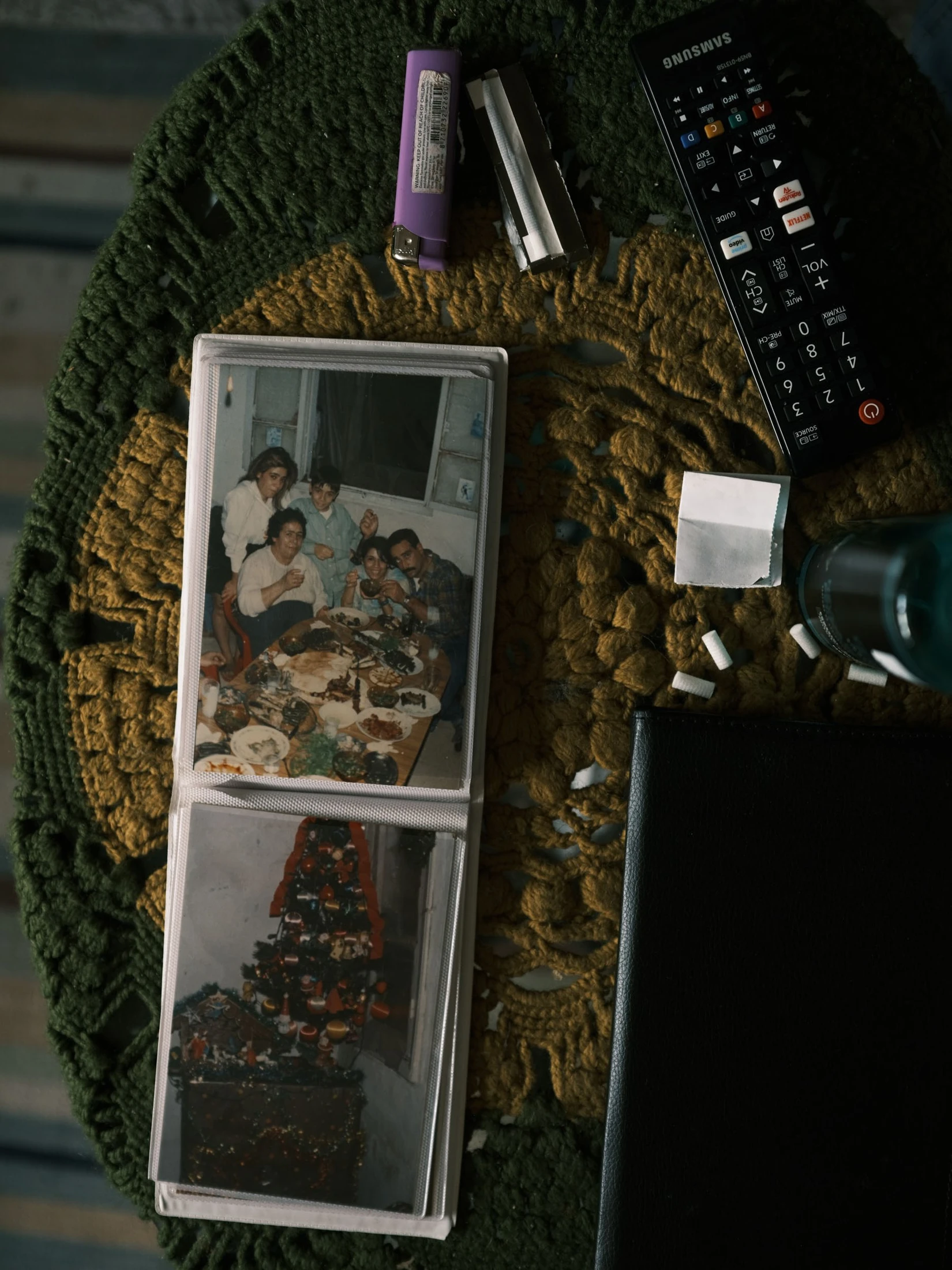 A phone displaying family photographs among personal belongings
