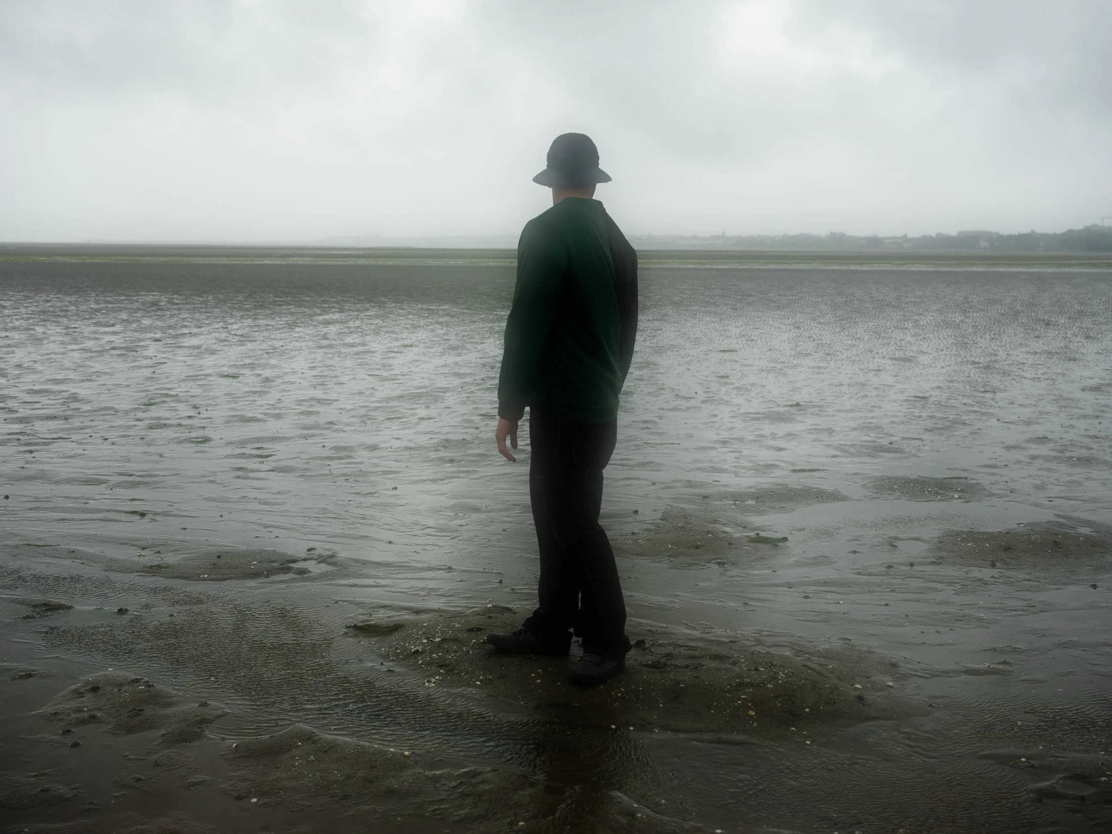 Salah standing beside the water